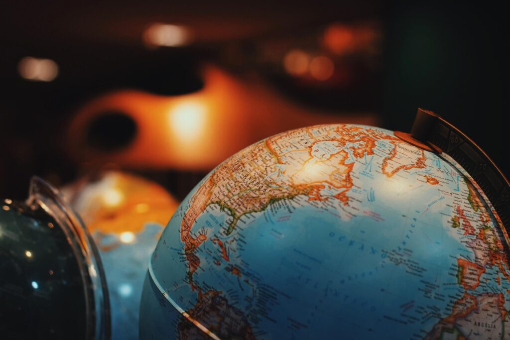 A globe in focus, two other globes behind it
