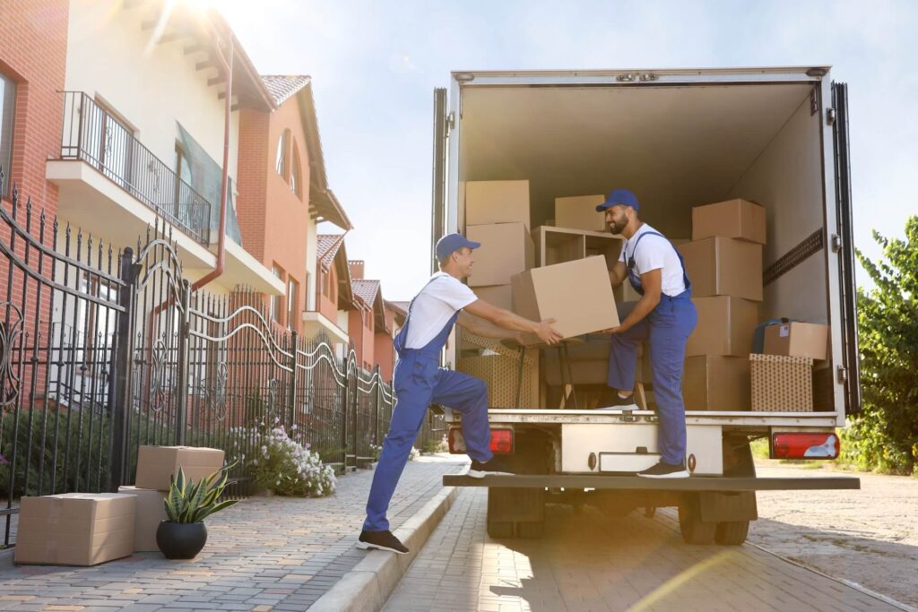 Two international movers loading a truck
