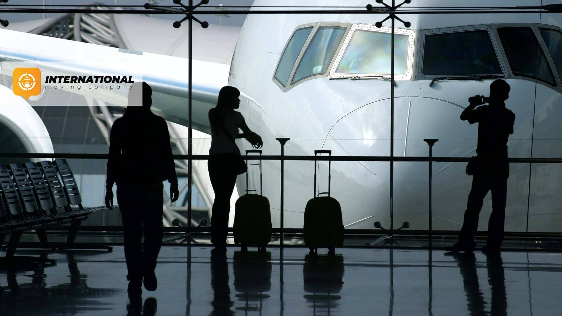 People on the airport International Moving Company Logo