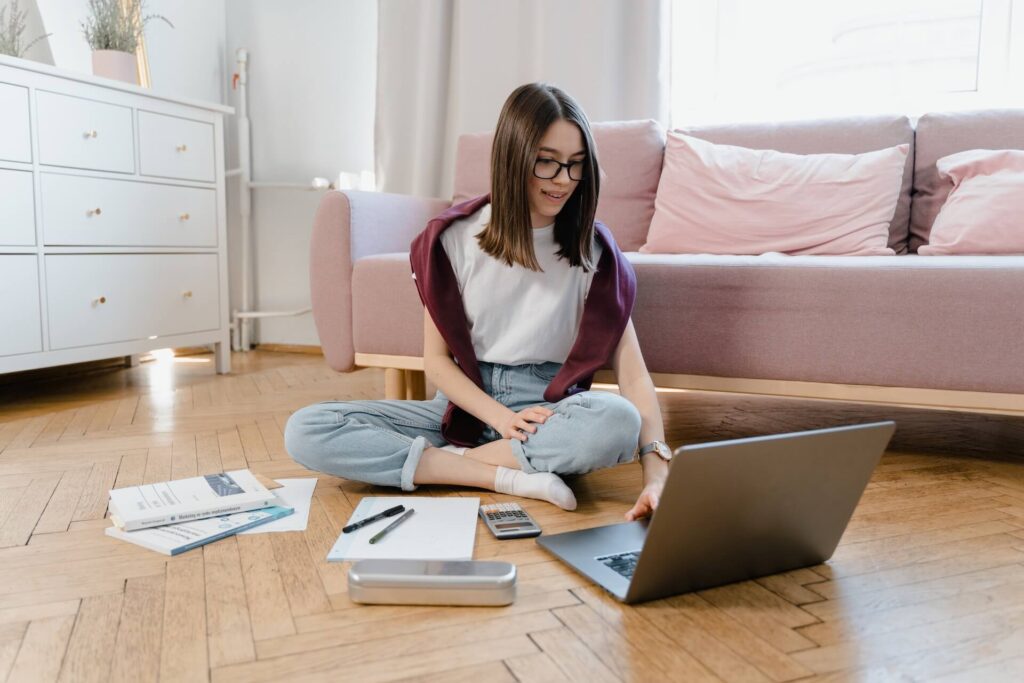 Girl looking for a job on her laptop