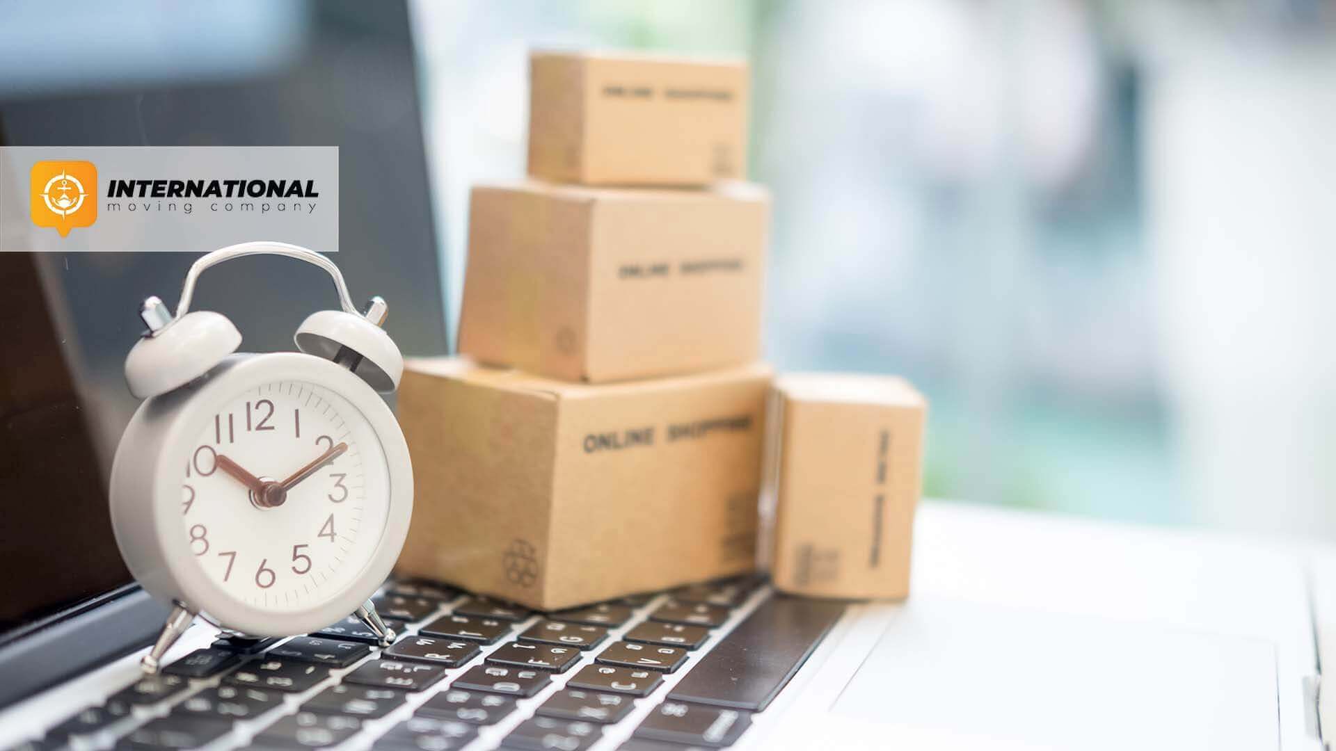 Little boxes and an alarm clock on a laptop