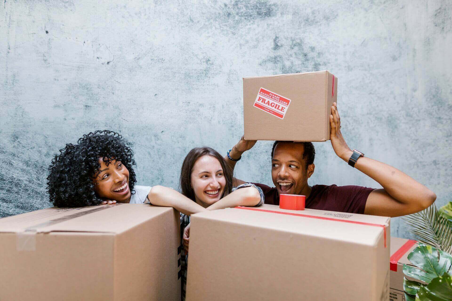 People laughing by the boxes