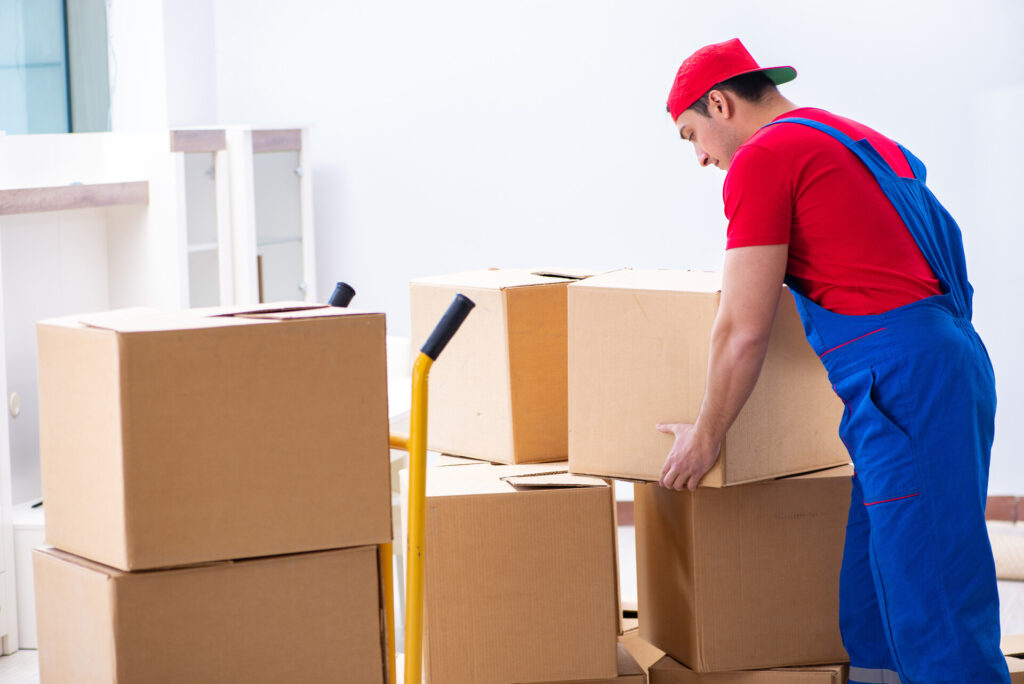 An international mover picking up a box