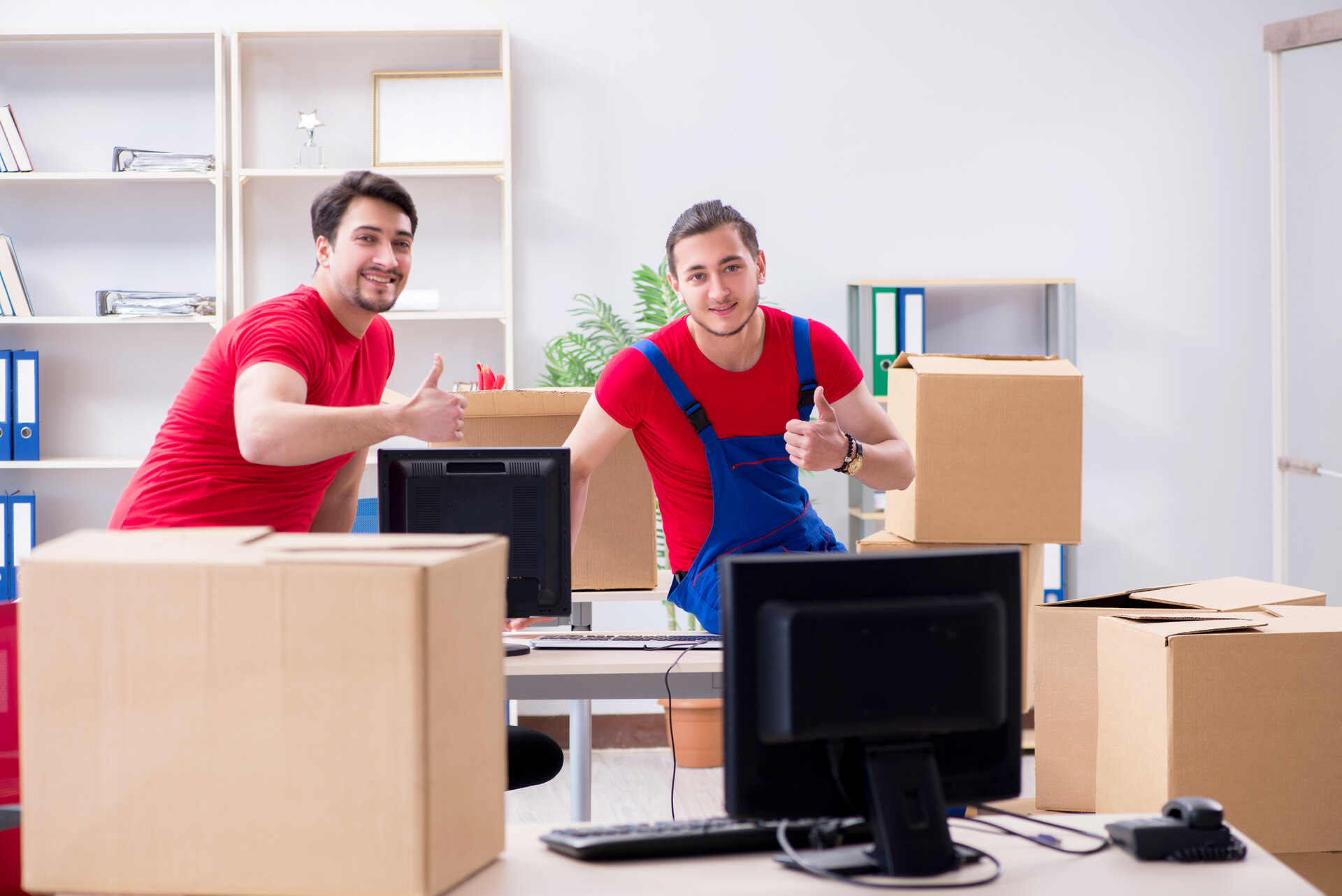 Two movers next to boxes